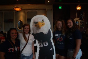 four Auggies pose with Auggie Eagle standup